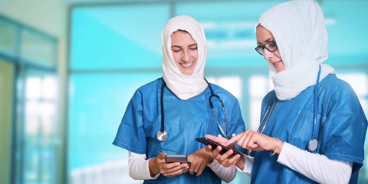 Clinicians using mobile devices for patient intake